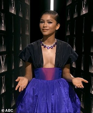 Dazzling: Zendaya looked beautiful in a jewel-toned gown with black sleeves