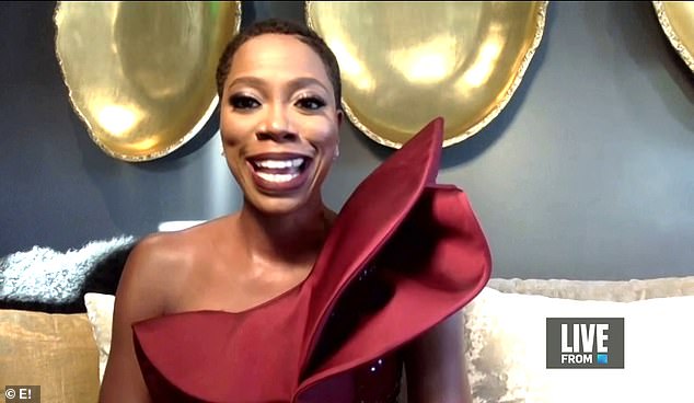 Smiling bright: Comedian Yvonne Orji shined in a sequin-encrusted one-shoulder red gown