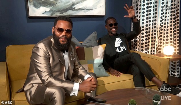 Looking sharp: Anthony Anderson donned a metallic suit and hung out with Sterling K. Brown