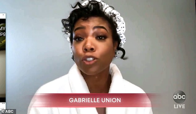 Bath chic: Gabrielle Union wrapped up in a white robe and shower hat