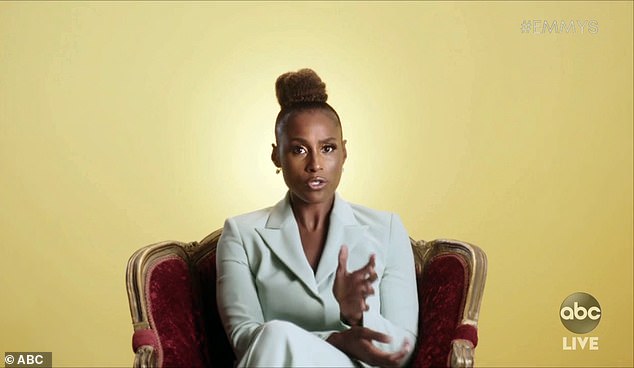 She means business: Insecure's Issa Rae opted for a pastel suit and a top knot