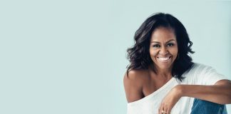 3 Attributes of A Great Female Leader and How to Harness Them in 2022 Michelle Obama smiling and sitting