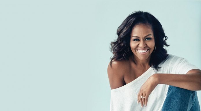 3 Attributes of A Great Female Leader and How to Harness Them in 2022 Michelle Obama smiling and sitting