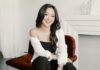Content Creator and CEO Vanessa Lau’s Number One Tip for Getting a Seat at the Table Vanessa Lau sitting and smiling