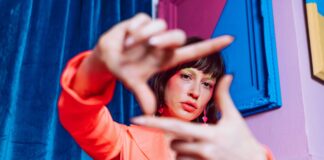 Gen Z’s Critical Message: “Hard Pass on Your Expectations” Young Gen Z woman looking through her own lens