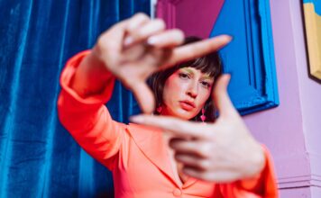 Gen Z’s Critical Message: “Hard Pass on Your Expectations” Young Gen Z woman looking through her own lens