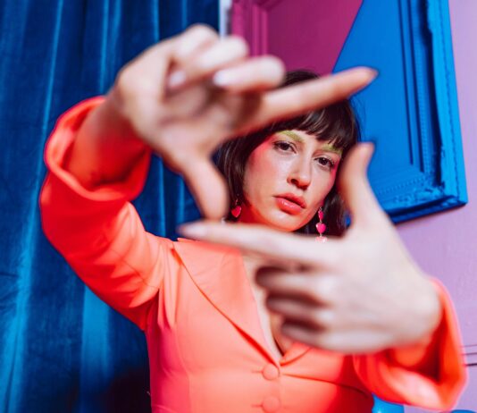 Gen Z’s Critical Message: “Hard Pass on Your Expectations” Young Gen Z woman looking through her own lens