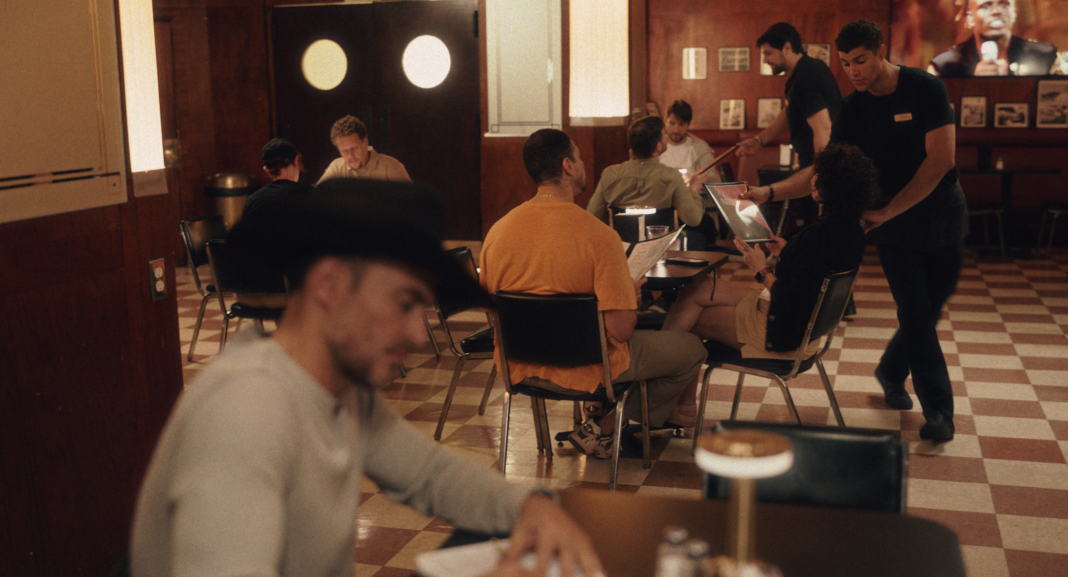 Still of Luca Castellani and Cheyenne Jackson in 'America'