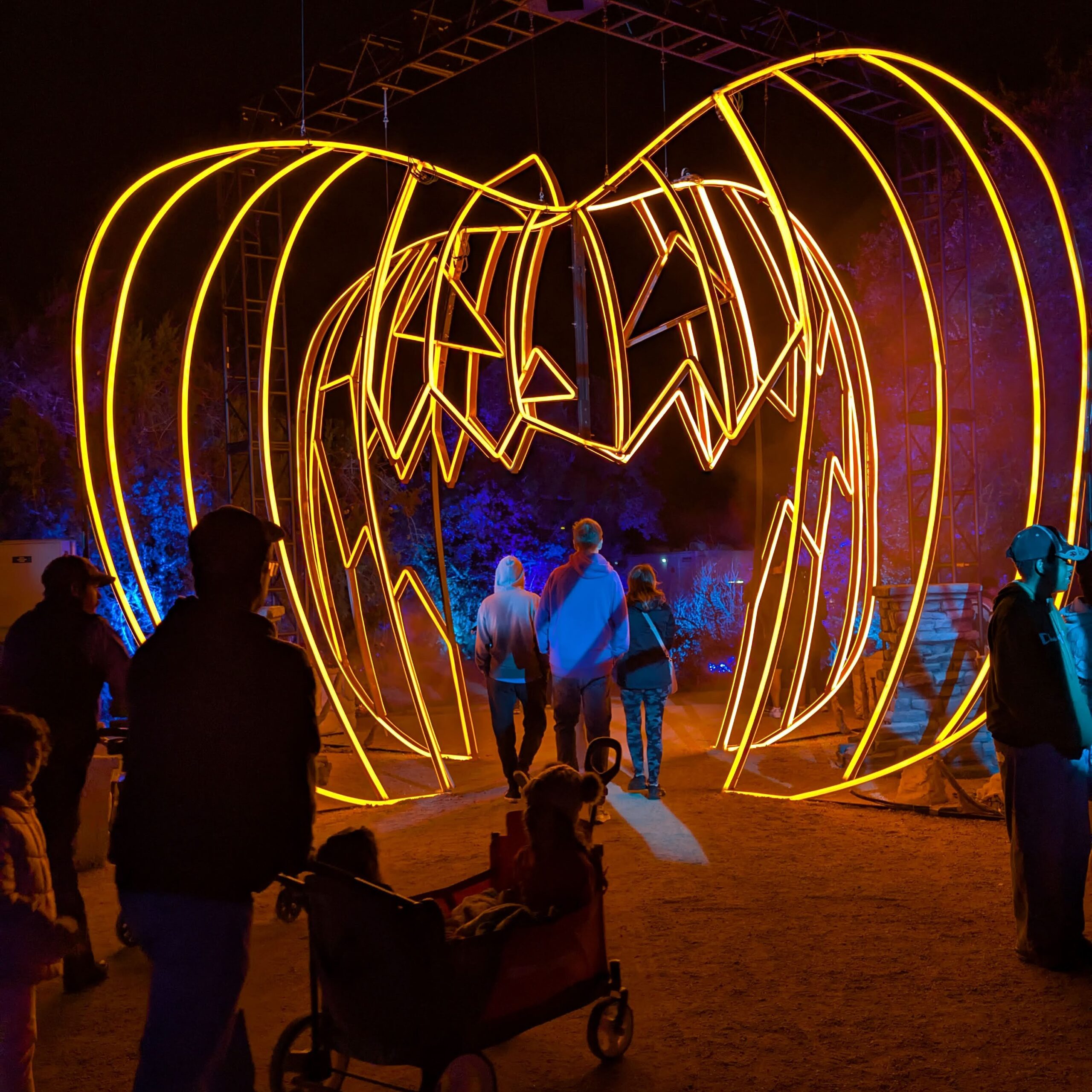 Gigantic walk-through pumpkin sculpture entrance to Disney Nightmare Before Christmas Light Trail, Austin TX