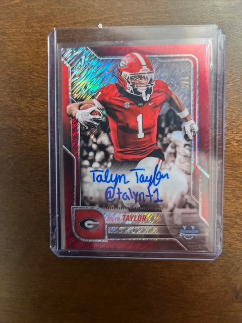 U Bowman Chrome Hobby Box containing an autographed Talyn Turner sports card in a protective slab on a wood background, representing card condition, rarity, and investment value.