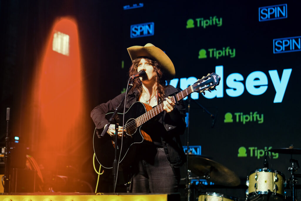 Lyndsey Beaver plays standing drums and sings at the SPIN x Tipify Road to Austin showcase during SXSW 2026 in Austin, Texas.