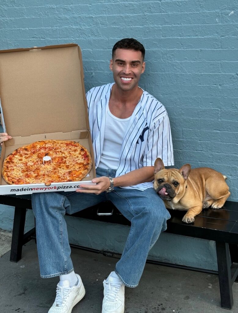 Feroz Khan in New York with pizza and his dog