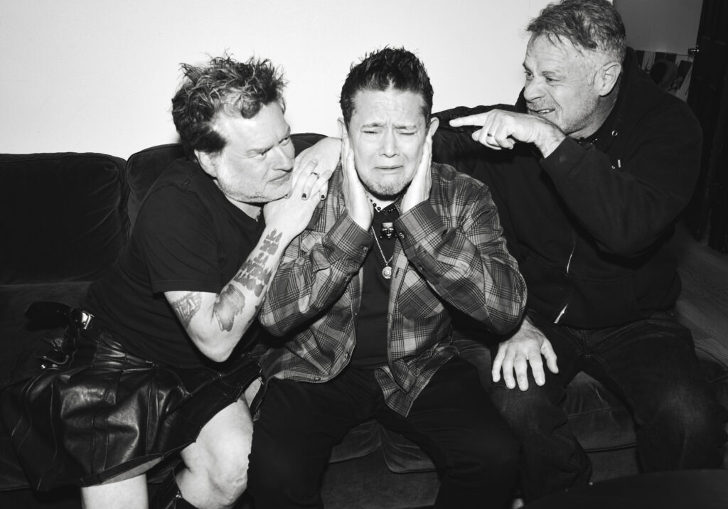 NOFX band members share a candid moment backstage in 40 Years of Fuckin Up documentary